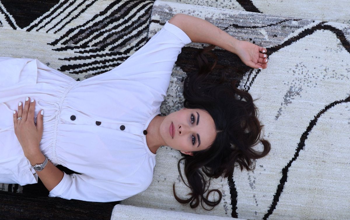 Close-up of a designer lying on a stylish Berber rug