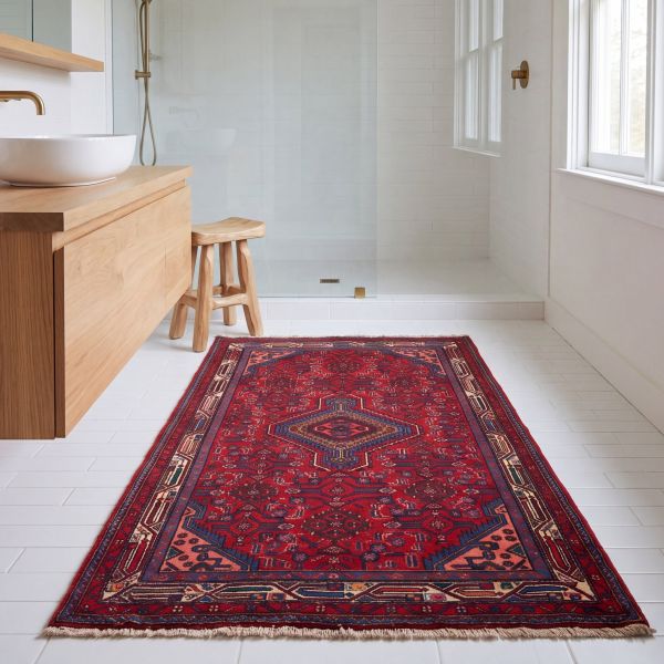 Dark red nomadic rug in a modern bathroom.