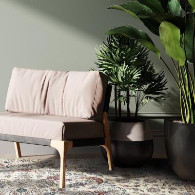 Ázsiai stílusú nappali, kézzel kötött szőnyeggel, lágy zöld árnyalatokban.