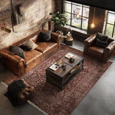 Modern Sadraa szőnyeg orientális mintával egy bőrszövet ülőgarnitúra alatt a nappaliban.