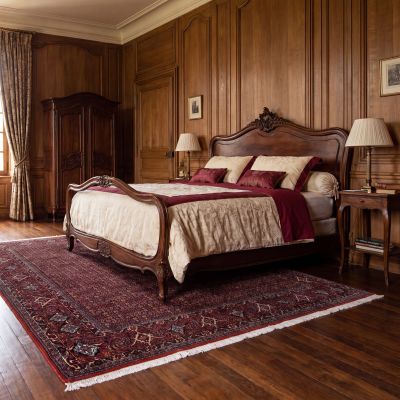 Hand-knotted rug in a classic bedroom