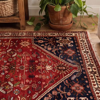 Oriental rug with a subtle pattern in the hallway with natural materials