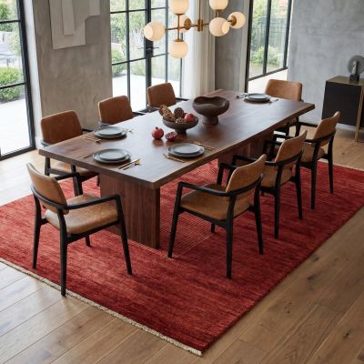 Elegant red designer rug in a modern, contemporary dining room interior