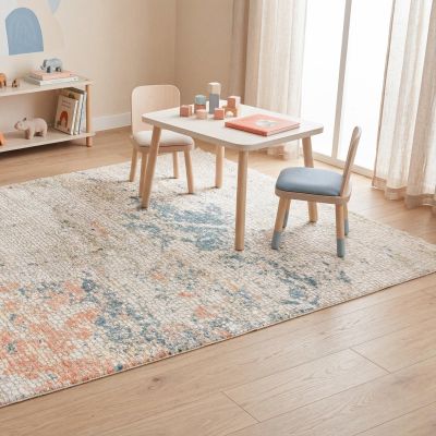 A stylish abstract designer rug in a modern children’s bedroom with contemporary furnishings