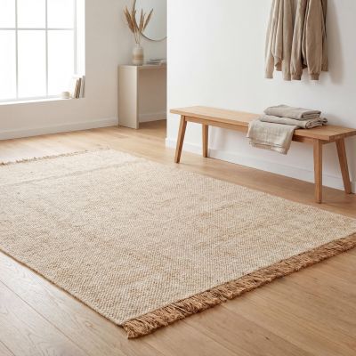 A hallway in a minimalist style with a simple rug.