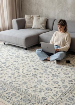 Fine Nain rug in cream and blue tones in a modern living area