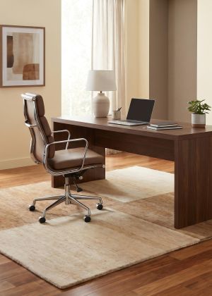 Hand-knotted Nepal rug in beige under a desk