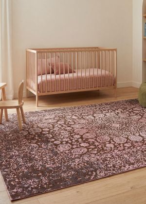 A designer rug in a modern children’s bedroom with a playful and stylish atmosphere.