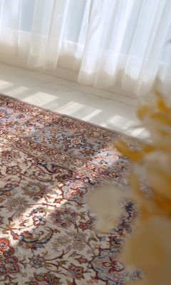 Hand-knotted Isfahan rug with a fine floral pattern in cream and beige