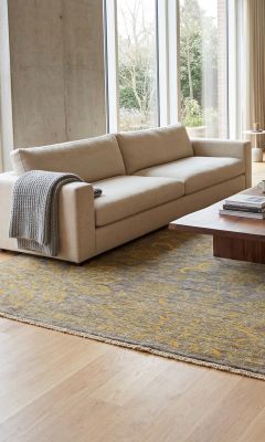 Modern designer rug in the living room with a subtle vintage pattern