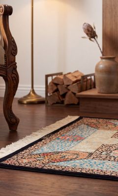 Hand-knotted Qom rug with traditional medallion pattern and silk sheen