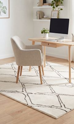 Modern designer rug in cream with black geometric pattern